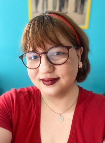 A person wearing glasses and a red shirt

AI-generated content may be incorrect.
