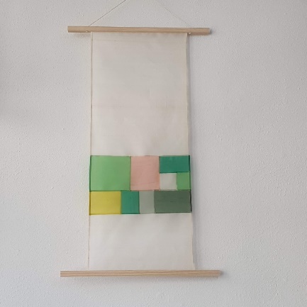 A white banner with colorful squares on it
AI-generated content may be incorrect.