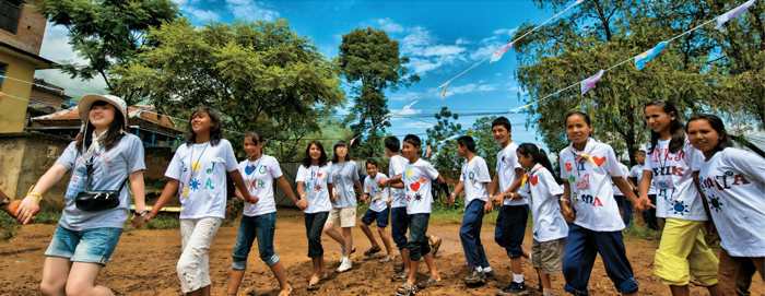 South Koreans serve the world as members of the international community through international cooperation carried out at the government level and through private organizations’ voluntary activities. (Photo: South Korean COPION volunteers with locals in Kathmandu, Nepal)